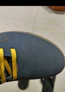 Blue and gray high top shoes