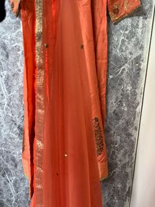 Elegant Orange Kurta Set with Embroidered Details