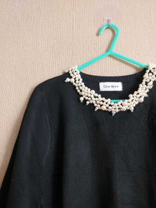Elegant Black Top with Pearl Detail