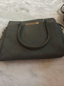 Versatile Dark Quilted Structured Handbag