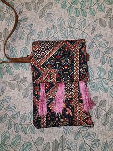 Vibrant Multicolored Sling Bag with Pink Tassels