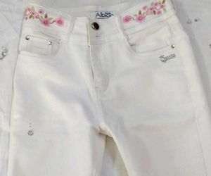 A Super Cool White Jean's With Neon Orange Top