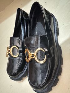 Black Loafers with Gold Detail