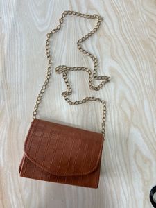 2 (brown/black) sling Crossbody Bag