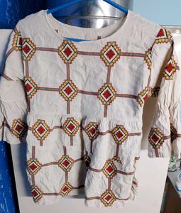 Embroidered Peplum Top