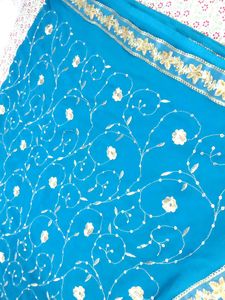 ✨ Teal Blue Saree with Golden Floral Elegance ✨