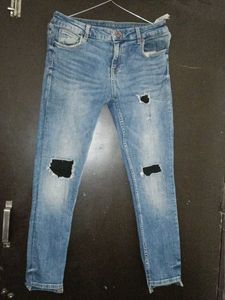 Ripped Knee Jeans