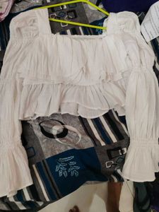 white bell bottom sleeves top.