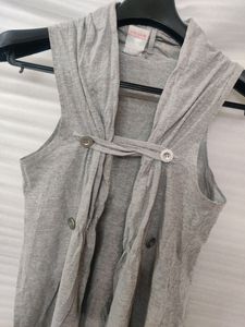 Grey Sleeveless Shrug With Button Holds