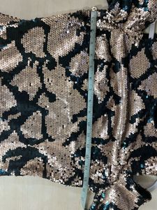 Embellished bodycon cold shoulder dress.