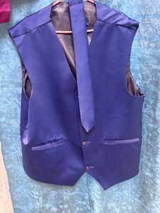 It Is a Blazer With Waist Coat And Tie