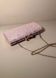 rose‑gold glitter box clutch with bow clasp, chain