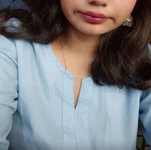 Blue Kurti With Silver Threads On It