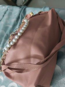 Stylish Pink Handbag with Chain Detail