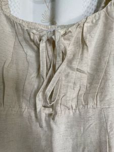 puff-sleeve cream midi dress