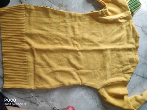 pretty yellow sweter with side pocket.
