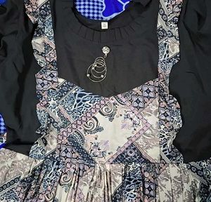 Patterned Dress with Unique Brooch