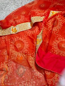 very pretty bandhani orange saree