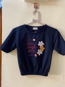 A Navy Blue Top With Flower Embroidery