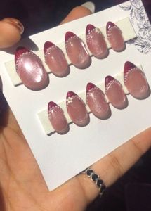 Cat eyew with red french tip Press-On Nails