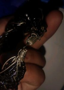 black breslet and a multi colour bangle