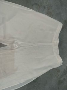 Beige Wide-Leg Sheer Overlay Trousers.
