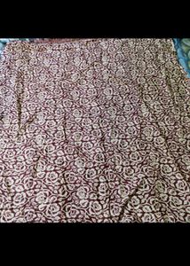 Elegant Green Saree with Flower Design