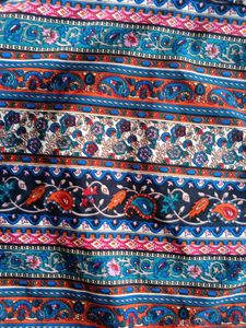 Patterned top traditional goes with black skirt