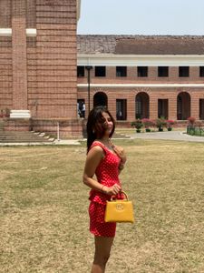 red dress with Polka Dot Handbag both
