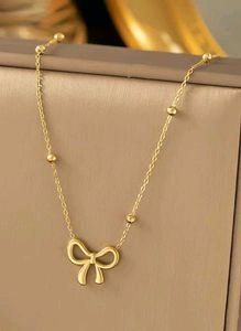 Gold Bow Pendant Necklace