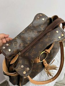 Louis Vuitton Logo Handbag with tassel