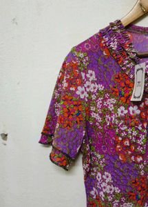 Trendy New Floral Ruffle Neck Top
