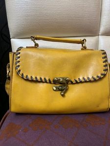 at half rate now mustard hand bag