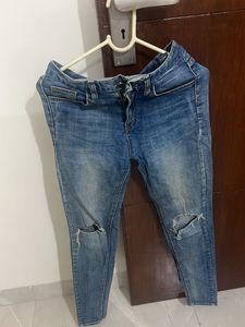 Ripped Knee Denim Jeans