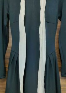 High Neck Solid Knotted Ruffle Hem Mini Dress