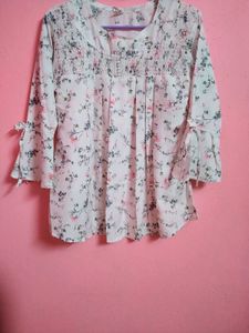 This white dress has beautiful floral designs on