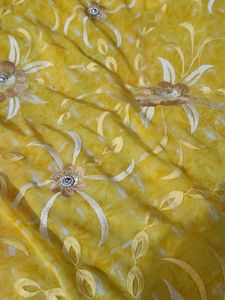 Yellow Saree with beautiful Flowers