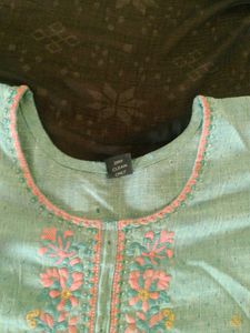 It&#39;s a Handworked Kurti.Bottle Green Colour.