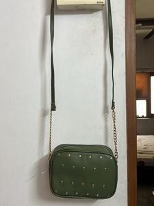 Party Wear Green Sling With Metal Chain Detail