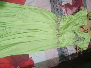 combo of parrot green  gown and ready made saree