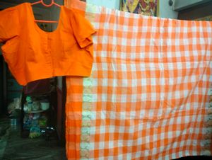 Orange Saree With Matching Blouse.