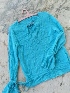 Light blue low-cut neck top
