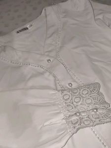 A White Shirt With Pearls