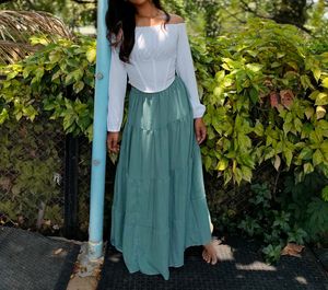 White Corset Top And Green Maxi Skirt
