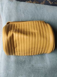Stylish Mustard Circular Sides Sling Bag