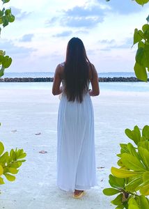 Long White Gown With A Beautiful Back Neck.