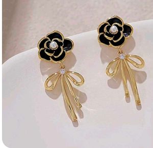 Black Flower And Bow Earrings