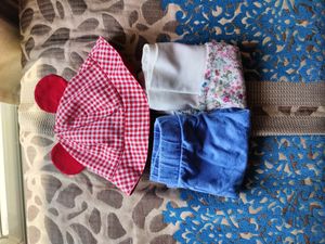 Mothercare joggers (set of 2) and a baby cap.