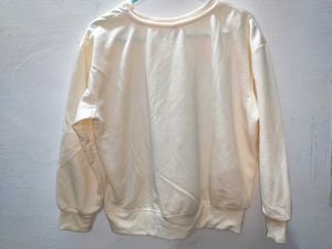Cream colored crewneck sweater