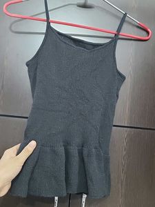 Sleeveless Black Peplum Top